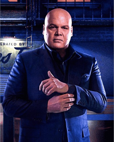 Man In Suit Standing Before Sign GIF