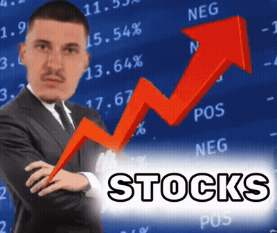 Man In Suit Standing Before Stocks Graph GIF