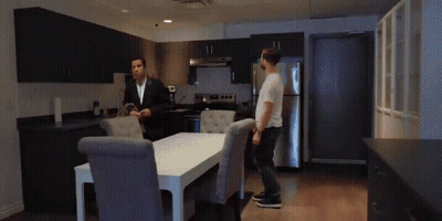 Man In Suit Standing Beside Man In White Shirt GIF