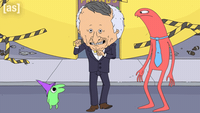 Man In Suit Standing Between Green And Red Monster GIF