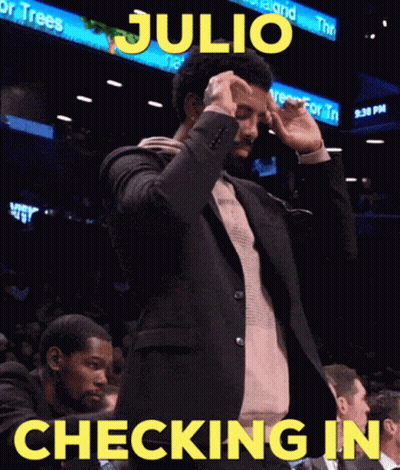 Man In Suit Standing By Checking In Sign GIF