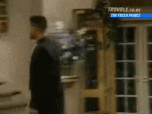 Man In Suit Standing By Door GIF