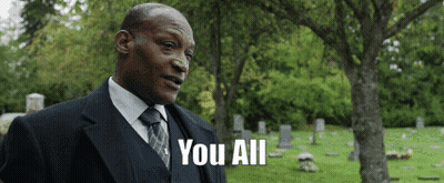 Man In Suit Standing In Cemetery Saying You All GIF