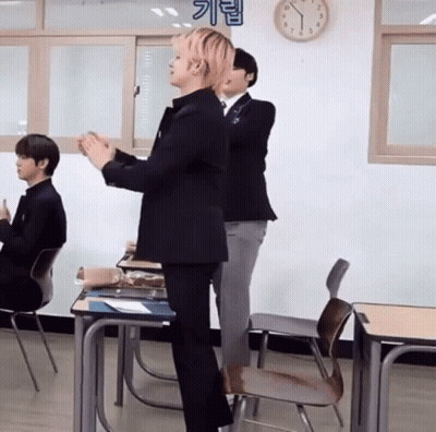 Man In Suit Standing In Classroom GIF