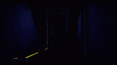 Man In Suit Standing In Dark Hallway GIF