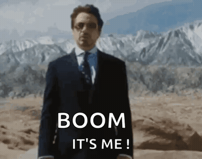 Man In Suit Standing In Desert With Mountains GIF