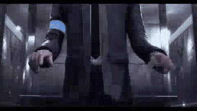 Man In Suit Standing In Elevator With Hands On Buttons GIF