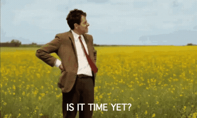Man In Suit Standing In Field Saying Is It Time Yet GIF