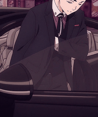 Man In Suit Standing In Front Of Aoyama Building GIF