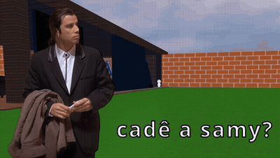 Man In Suit Standing In Front Of Brick Wall GIF