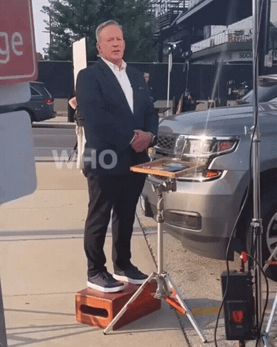 Man In Suit Standing In Front Of Car Saying Who GIF