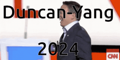 Man In Suit Standing In Front Of CNN Logo GIF