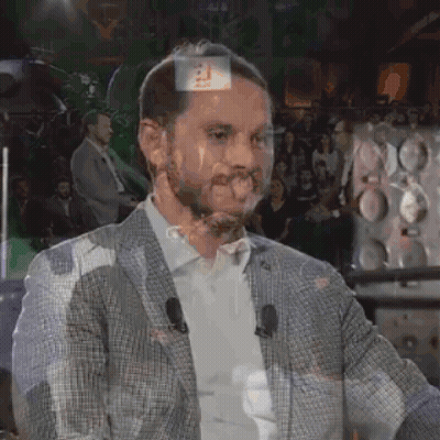 Man In Suit Standing In Front Of Crowd GIF