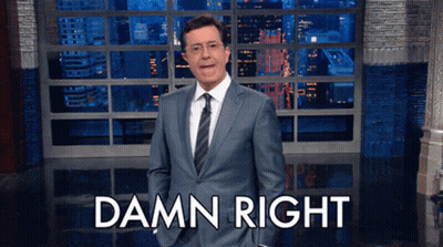Man In Suit Standing In Front Of Damn Right Sign GIF