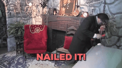 Man In Suit Standing In Front Of Fireplace Saying Nailed It GIF