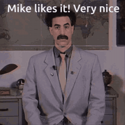Man In Suit Standing In Front Of Map Saying Mike Likes It Very Nice GIF
