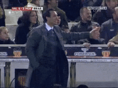 Man In Suit Standing In Front Of Powerade Advertisement GIF