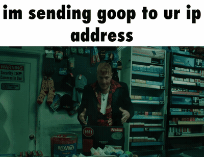 Man In Suit Standing In Front Of Red Wine Container GIF