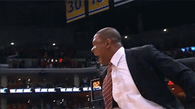 Man In Suit Standing In Front Of Scoreboard Saying 02 0 GIF