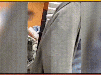 Man In Suit Standing In Front Of Shopping Cart GIF