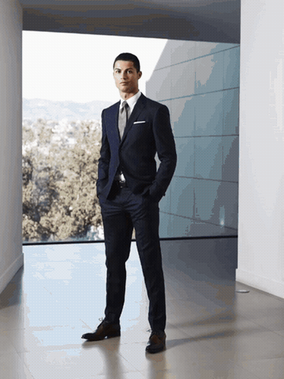 Man In Suit Standing In Front Of Window GIF