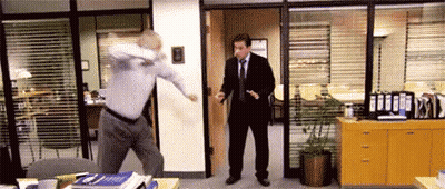 Man In Suit Standing In Office Doorway GIF
