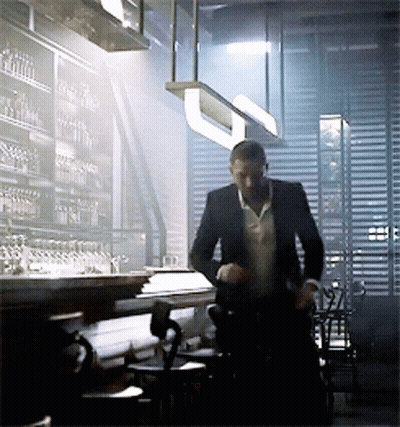 Man In Suit Standing In Restaurant GIF