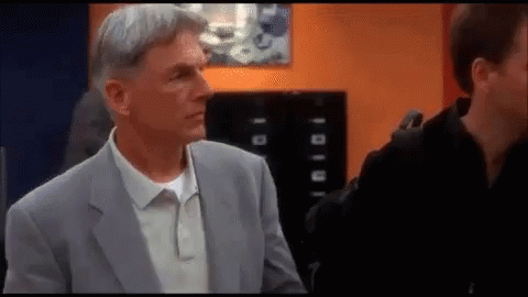 Man In Suit Standing Next To Another GIF