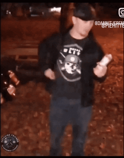 Man In Suit Standing Next To Exposing Friends Sign GIF