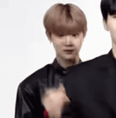 Man In Suit Standing Next To Man In Black Jacket GIF