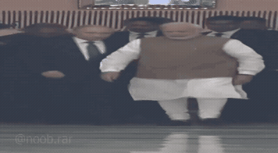 Man In Suit Standing Next To Man In White Shirt GIF