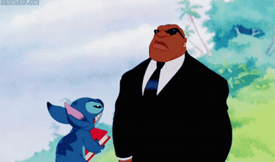 Man In Suit Standing Next To Stitch GIF