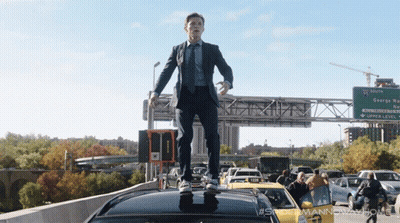 Man In Suit Standing On Car Roof By George Way Sign GIF