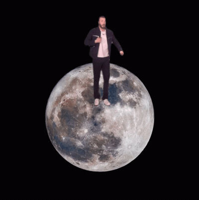 Man In Suit Standing On Moon GIF