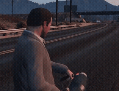 Man In Suit Standing On Road With Red Light From Hand GIF