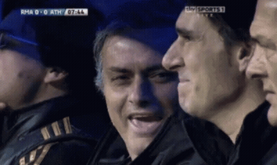 Man In Suit Standing On Soccer Field GIF