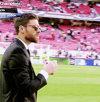 Man In Suit Standing On Soccer Field GIF