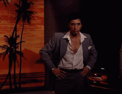 Man in Suit Standing with Hands on Hips
