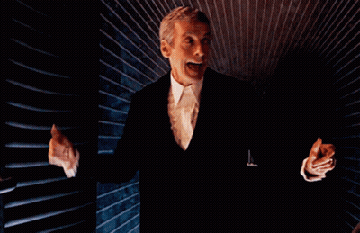 Man In Suit Standing With Hands Outstretched GIF