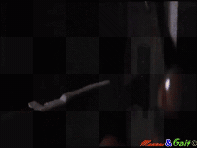 Man In Suit Stands In Front Of Music Brainz Logo GIF