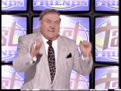 Man In Suit Stands In Front Of TV Wall Saying Friends GIF