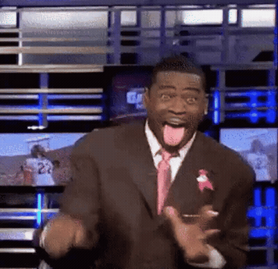 Man In Suit Sticking Tongue Out In Front Of TV GIF