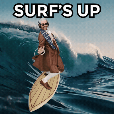 Man In Suit Surfing Wave Saying Surf's Up GIF