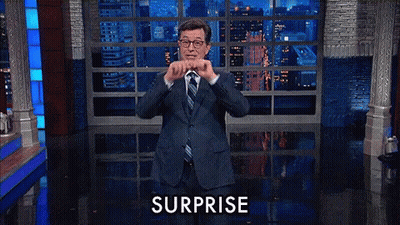 Man In Suit Surprised On Stage GIF