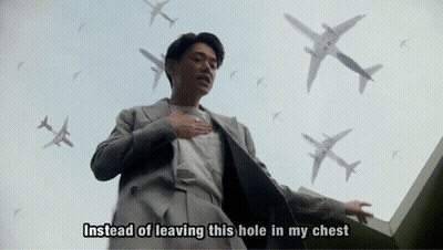 Man In Suit Surrounded By Airplanes Saying Instead Of Leaving This Hole In My Chest GIF