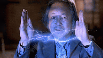 Man In Suit Surrounded By Lightning Strikes GIF