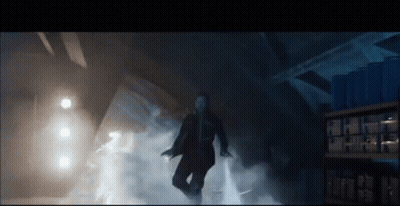 Man In Suit Surrounded By Smoke GIF