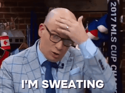 Man In Suit Sweating Holding Head GIF