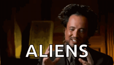 Man In Suit Talking About Aliens And Funny Face GIF