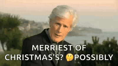 Man In Suit Talking About Christmas By Water GIF